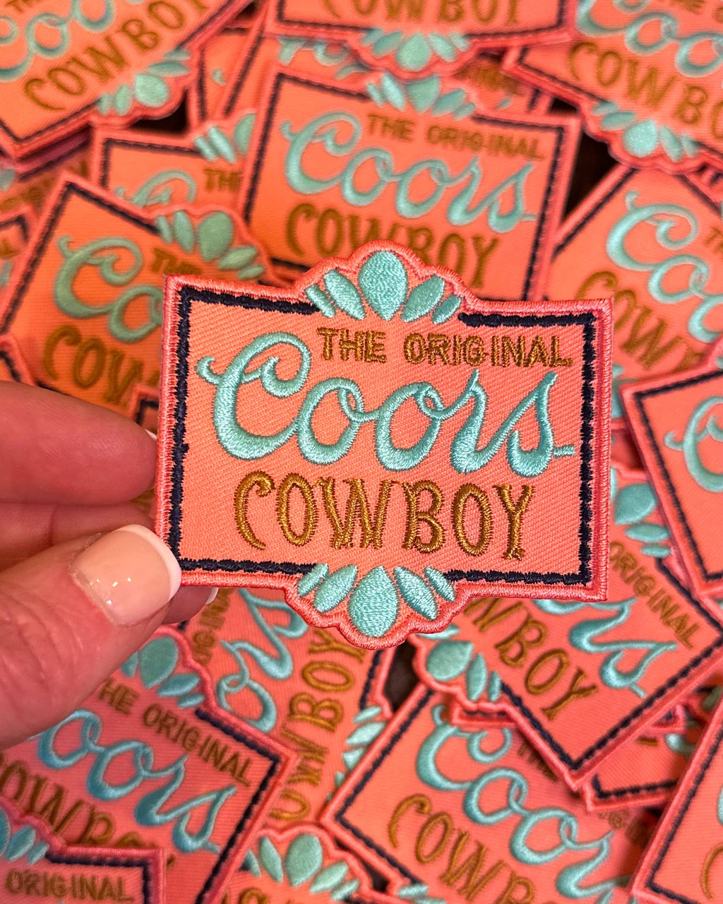 C**rs Cowboy Turquoise and coral Beer Trucker Hat Patch